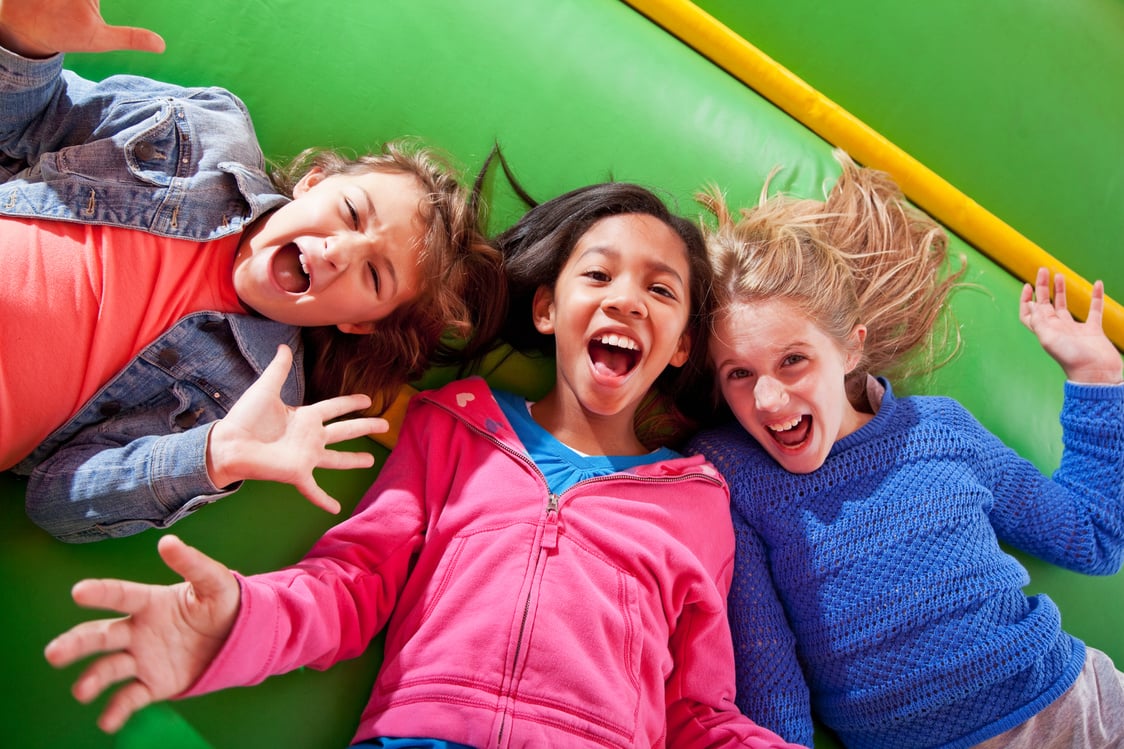 Girls lying down in bounce house