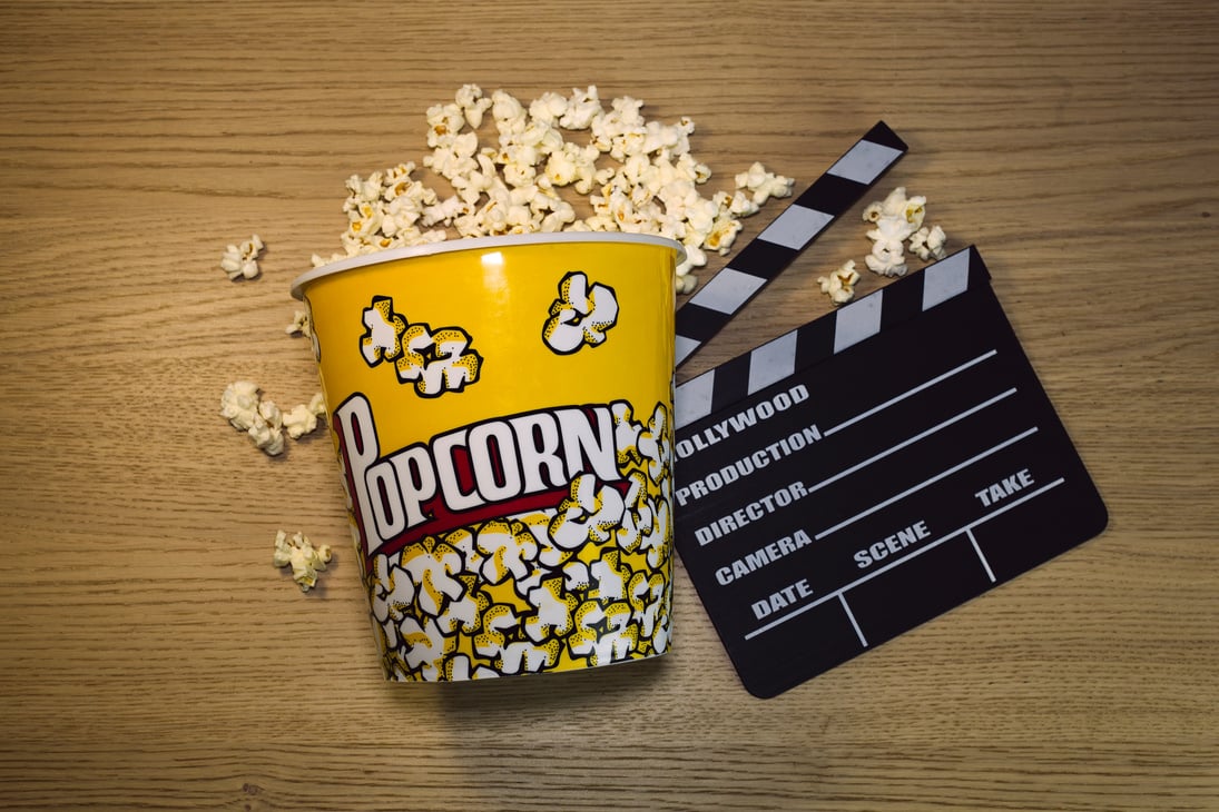 Overhead Shot of a Bucket of Popcorn and a Clapperboard